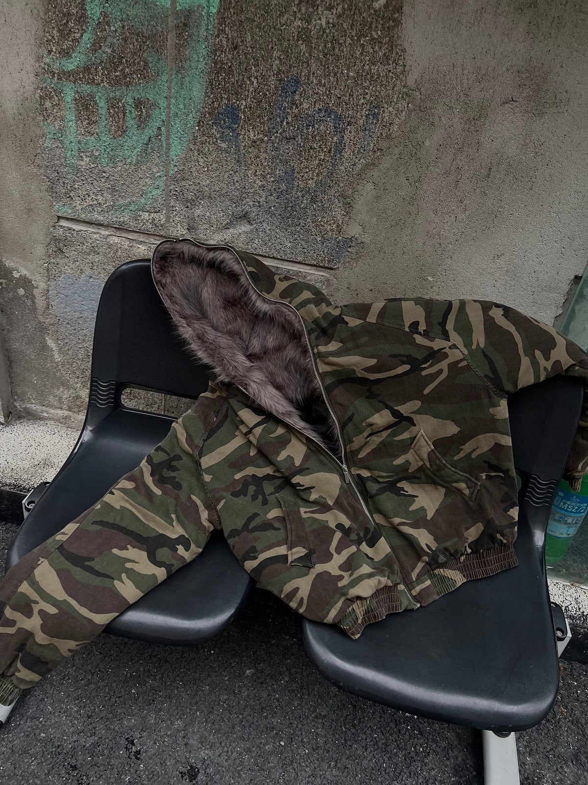 BLACK ENERGY CAMO FUR HOOD JACKET; Camo; front view in a styled setting