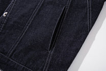 MCCNN ASYMMETRIC CONTRAST STITCH TRUCKER JACKET; Black; garment construction detail