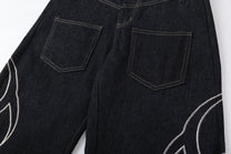 CHAOGU EMBROIDERED BAGGY BARREL JEANS; Black; garment construction detail