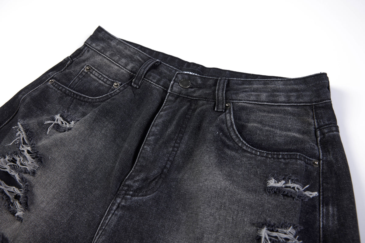 SMK MADE SLASH DISTRESSED WIDE LEG JEANS; Black; garment construction detail