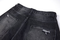 SMK MADE SLASH DISTRESSED WIDE LEG JEANS; Black; garment construction detail