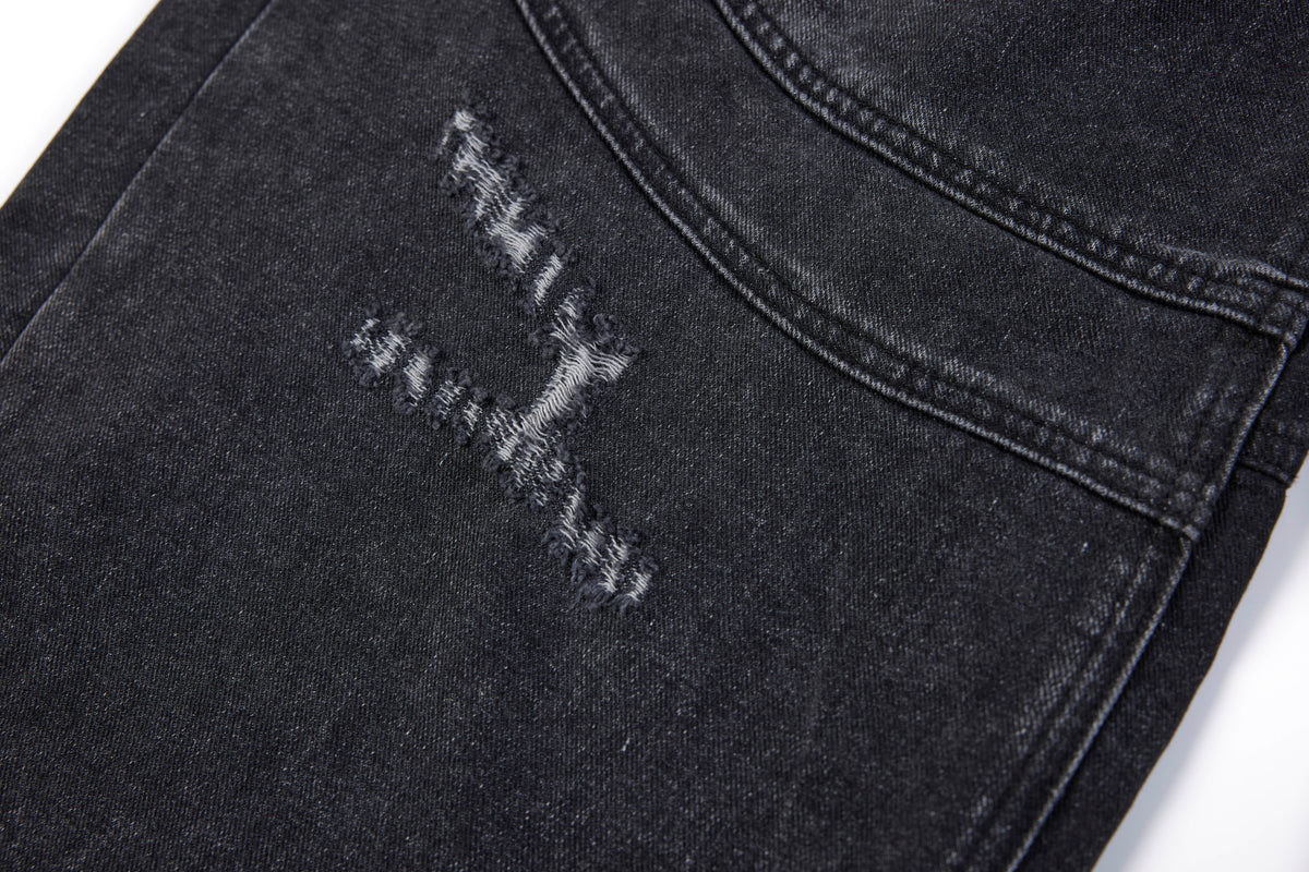 SMK MADE SLASH DISTRESSED WIDE LEG JEANS; Black; design detail