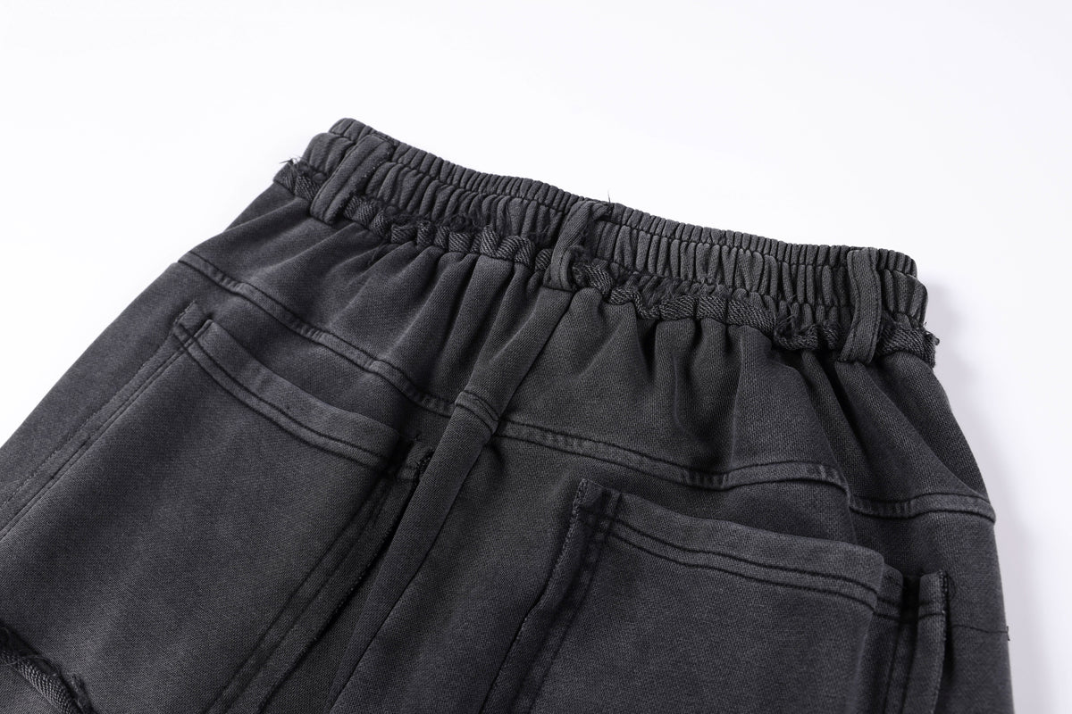 SMK MADE STUDDED WASHED WIDE LEG JEANS; Washed Black; garment construction detail