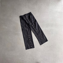 SMK MADE BUTTON FLAP WIDE LEG JEANS; Raw Black; front view in a styled setting