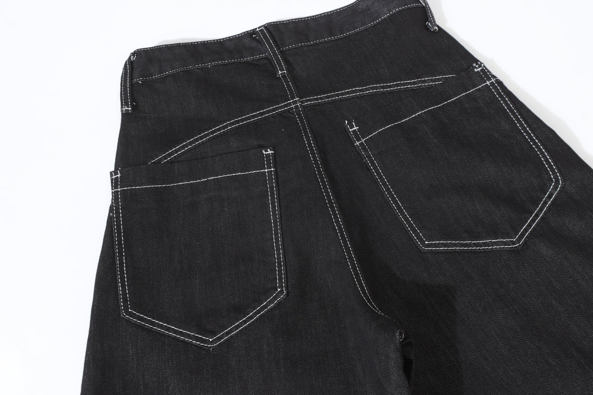 UNF BUTTON RAW BAGGY BARREL JEANS; Black; garment construction detail