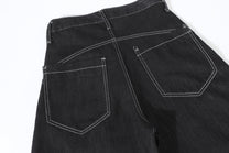 UNF BUTTON RAW BAGGY BARREL JEANS; Black; garment construction detail