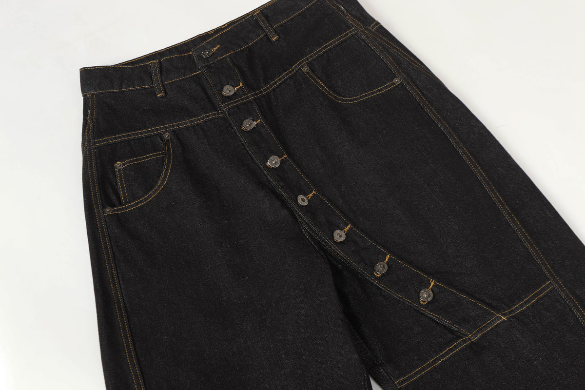 UNF ASYMMETRIC BUTTON PANEL JEANS; Black; garment construction detail