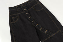 UNF ASYMMETRIC BUTTON PANEL JEANS; Black; garment construction detail