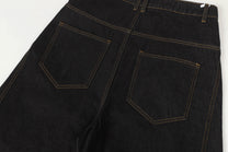 UNF ASYMMETRIC BUTTON PANEL JEANS; Black; garment construction detail