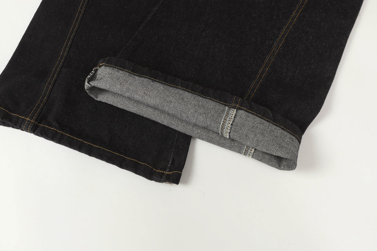 UNF ASYMMETRIC BUTTON PANEL JEANS; Black; garment construction detail