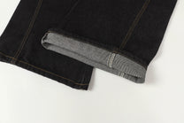 UNF ASYMMETRIC BUTTON PANEL JEANS; Black; garment construction detail