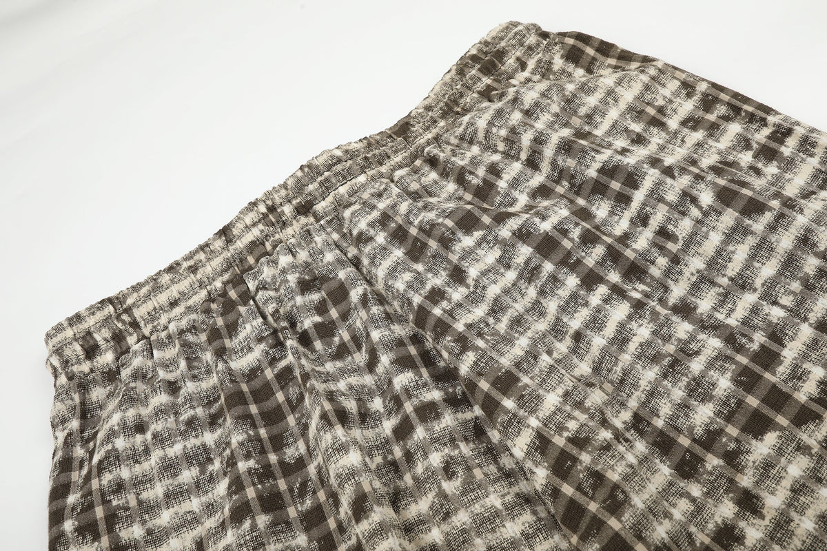 BLACK ENERGY DISTRESSED PLAID TROUSERS; Brown; garment construction detail