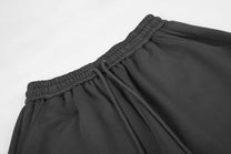 GEESAS STAR APPLIQUE BAGGY BARREL SWEATPANTS; Black; garment construction detail