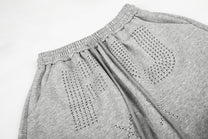GEESAS STUDDED WASHED BAGGY BARREL SWEATPANTS; Gray; design detail