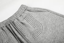 GEESAS STUDDED WASHED BAGGY BARREL SWEATPANTS; Gray; design detail