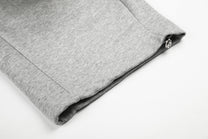 GEESAS STUDDED WASHED BAGGY BARREL SWEATPANTS; Gray; garment construction detail