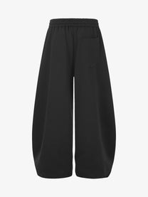 GEESAS STUDDED WASHED BAGGY BARREL SWEATPANTS; Black; back view