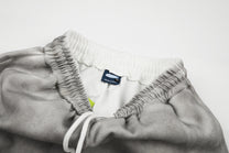 GEESAS DIAGONAL LETTER GRAPHIC SWEATPANTS; Gray; garment construction detail