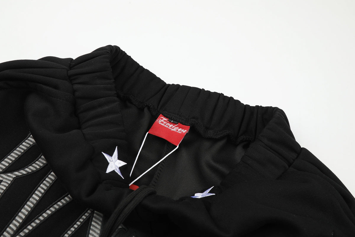 GEVANN STAR LETTER GRAPHIC SWEATPANTS; Black; garment construction detail