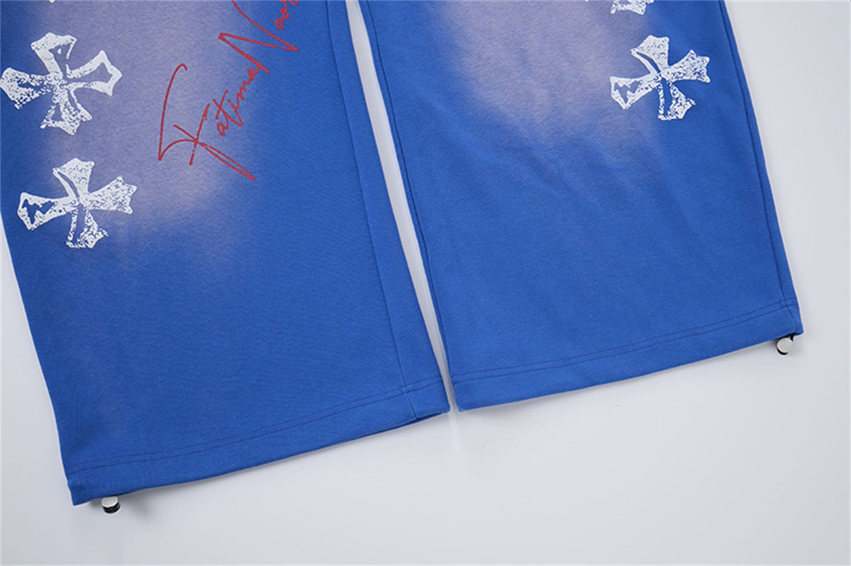 LETS ROCK CROSS SPRAY GRAPHIC SWEATPANTS; Blue; design detail