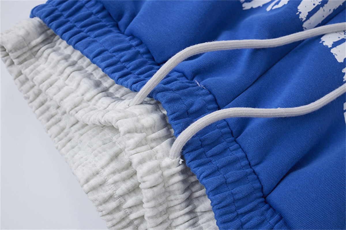 LETS ROCK CROSS SPRAY GRAPHIC SWEATPANTS; Blue; garment construction detail