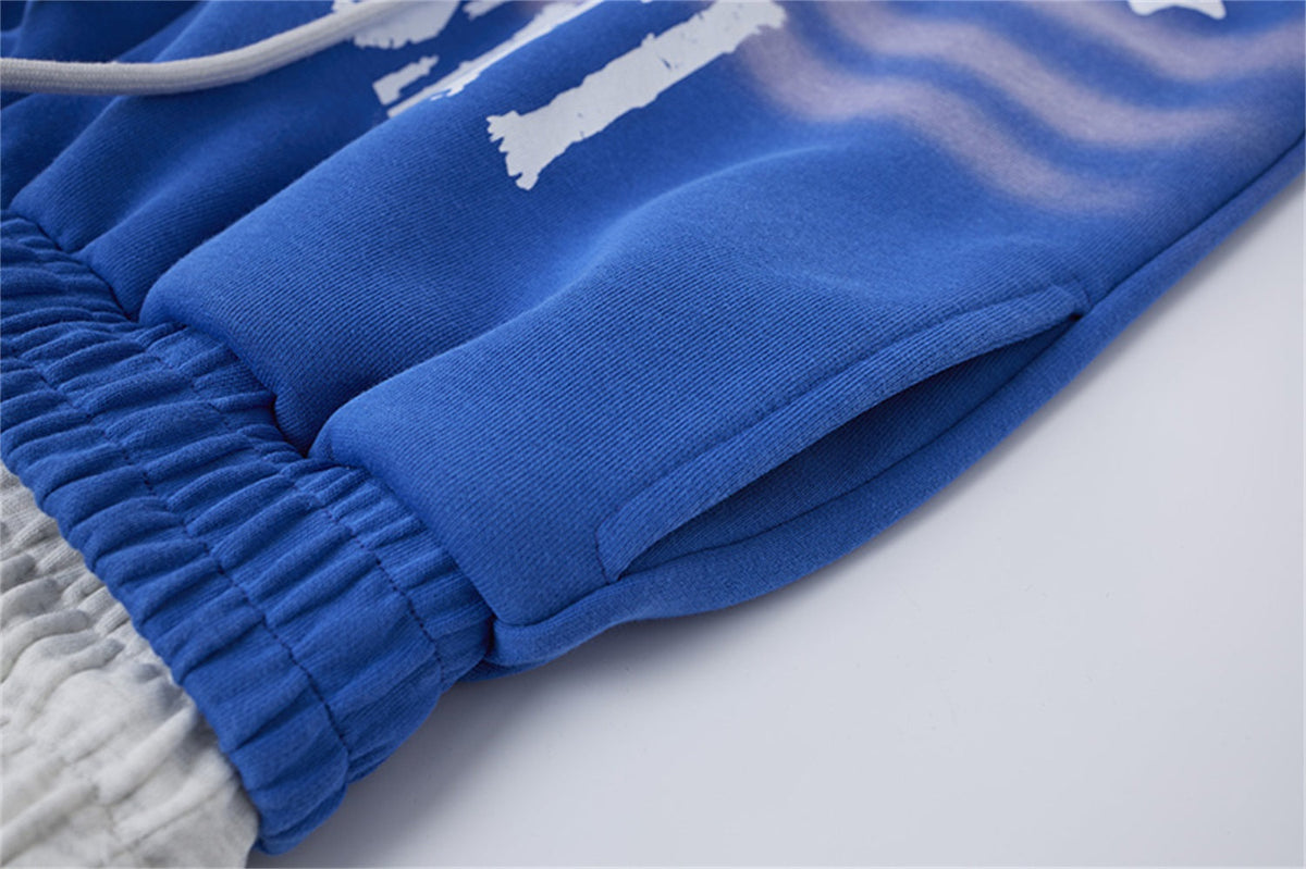 LETS ROCK CROSS SPRAY GRAPHIC SWEATPANTS; Blue; garment construction detail