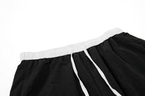 OREETA SCRIPT STRIPE TRACK PANTS; Black; garment construction detail