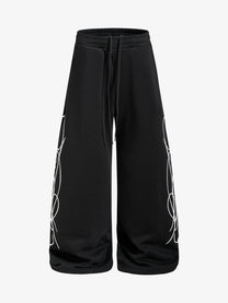 SKATE PARK CAMO DRAWSTRING BAGGY SWEATPANTS; Black; front view