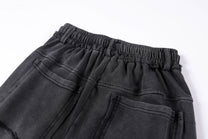 SMK MADE STUDDED WASHED WIDE LEG PANTS; Black; garment construction detail