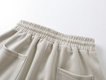 SMK MADE THORN PRINT BAGGY BARREL SWEATPANTS; Beige; garment construction detail