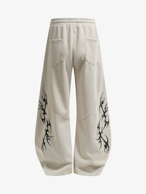 SMK MADE THORN PRINT BAGGY BARREL SWEATPANTS; Beige; back view