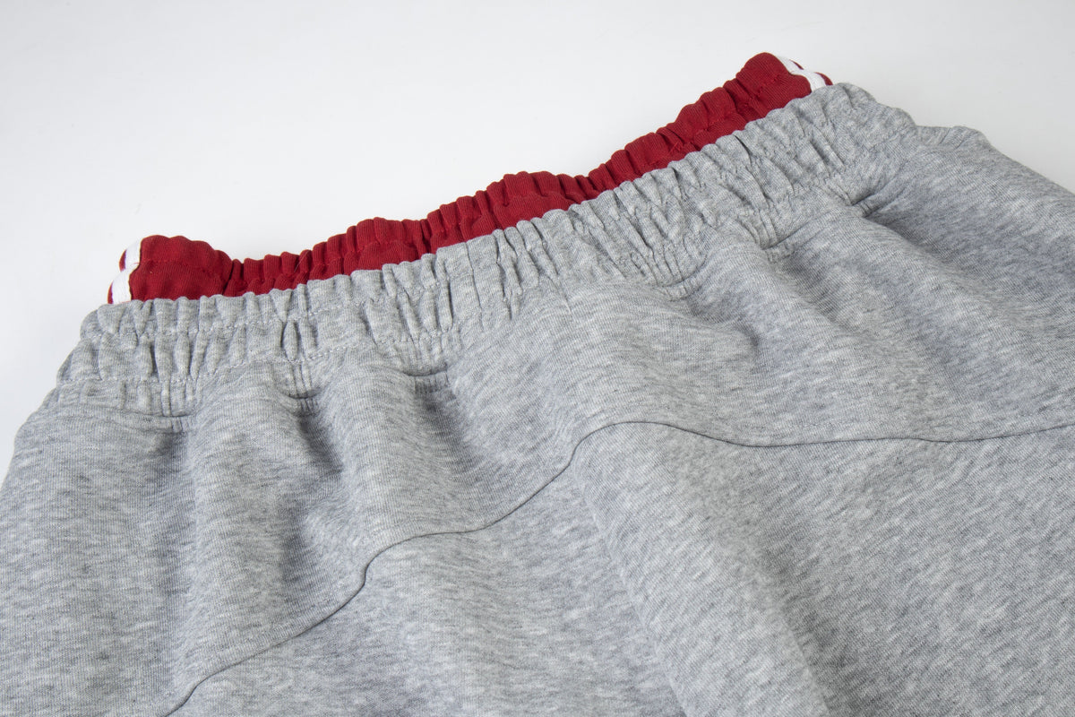 ZHANLAI RACING CREST GRAPHIC SWEATPANTS; Gray; garment construction detail