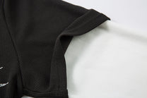 MCCNN THORN CROSS LAYERED POLO SHIRT; Black; garment construction detail