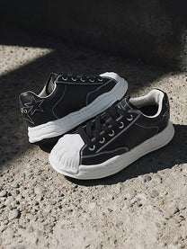 KAALIXTO STAR DETAIL SHELL TOE SNEAKERS; Black; styled product view