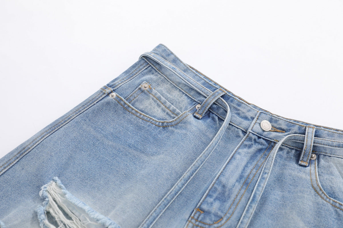 BLANKIN DISTRESSED RAW EDGE JORTS; Blue; garment construction detail