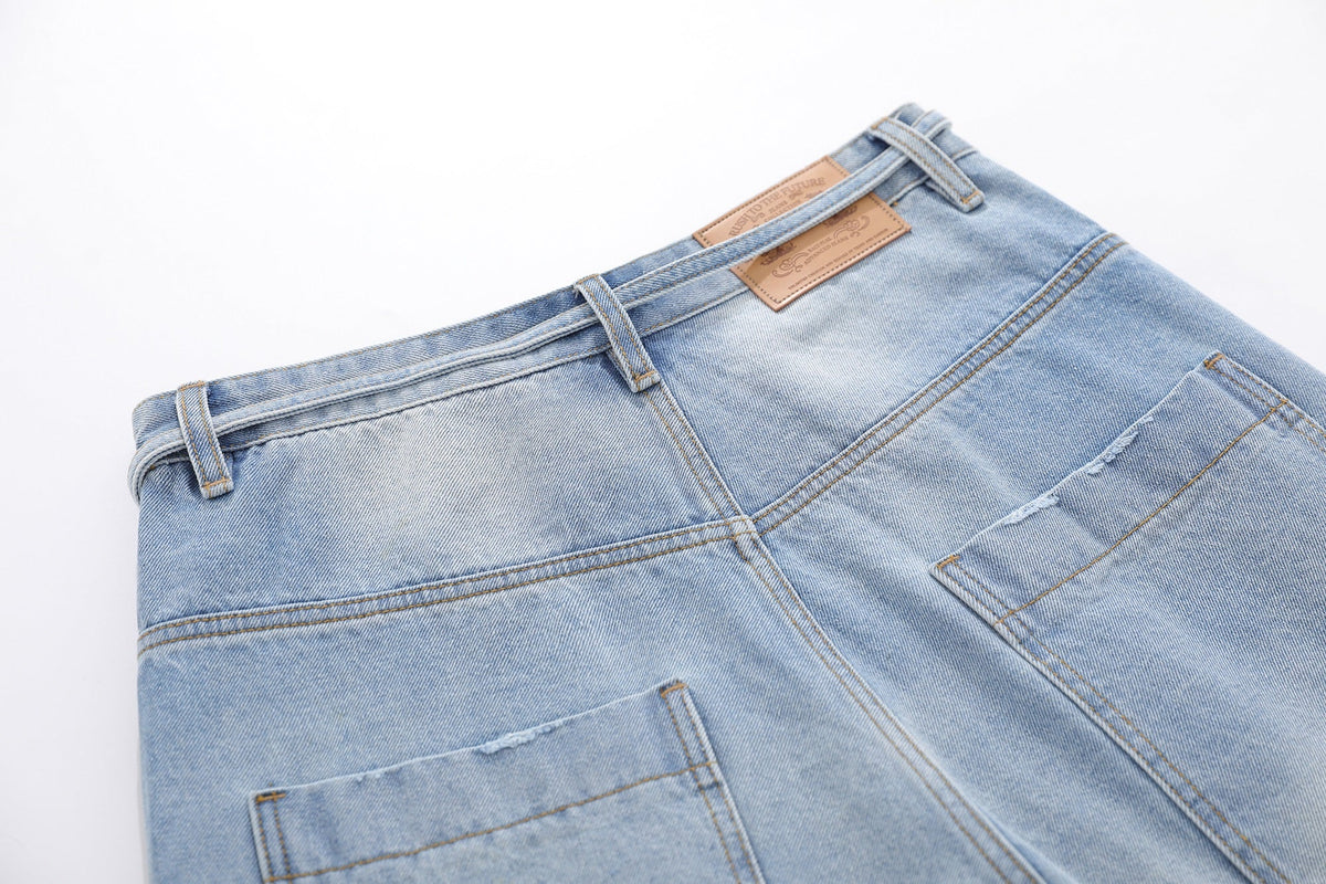 BLANKIN DISTRESSED RAW EDGE JORTS; Blue; garment construction detail