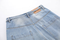 BLANKIN DISTRESSED RAW EDGE JORTS; Blue; garment construction detail