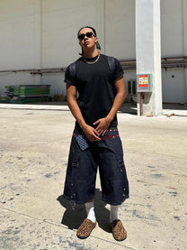 DND4DES STAR STUDDED PANEL DENIM SHORTS; Gray; model view