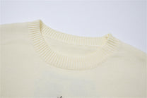 LETS ROCK VERTICAL LETTER CROSS SWEATER; Beige; garment construction detail