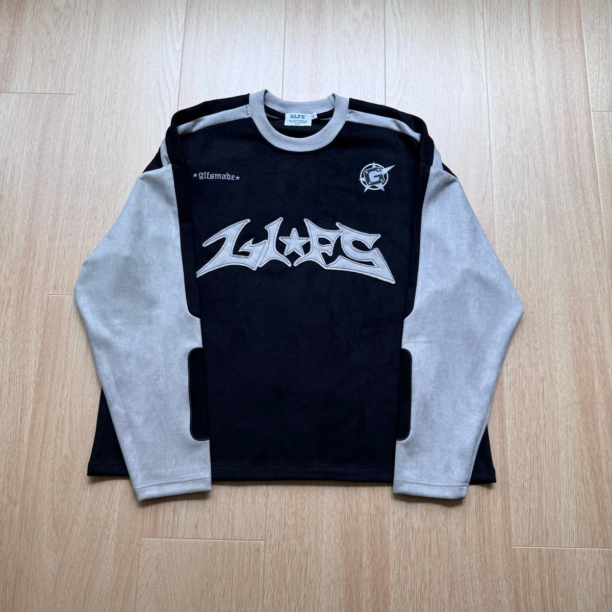 GLFS CONTRAST PANEL LOGO SWEATSHIRT; Black; front view in a styled setting