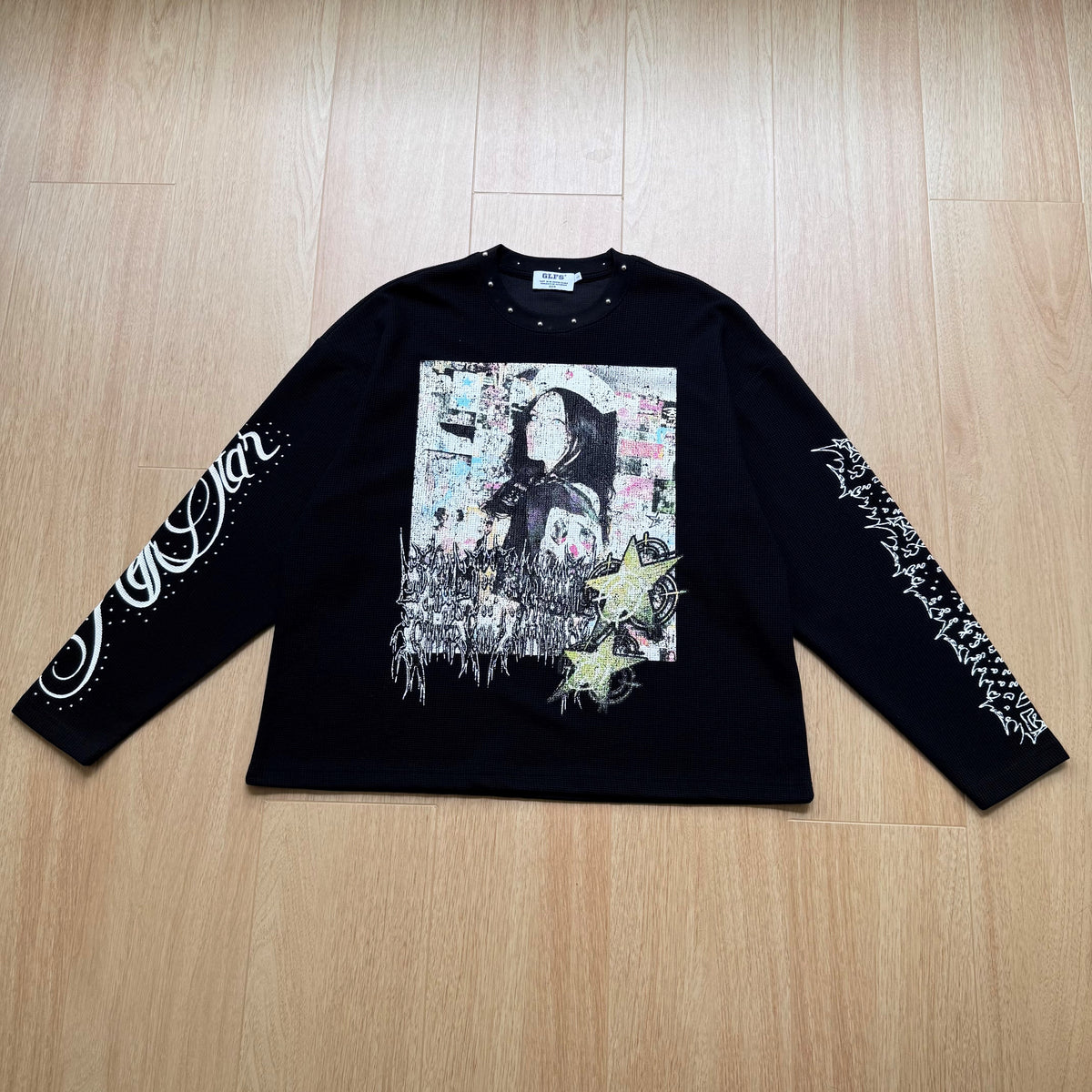GLFS STUDDED SLEEVE PORTRAIT SWEATSHIRT; Black; front view in a styled setting