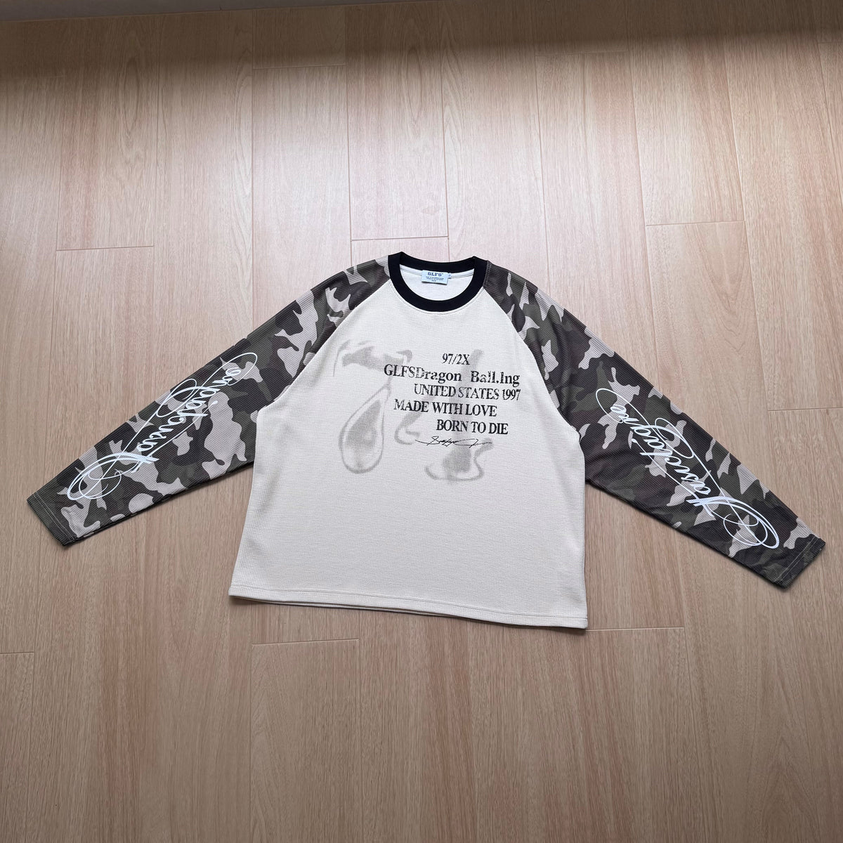 GLFS CAMO SLEEVE SLOGAN SWEATSHIRT; Cream; front view in a styled setting