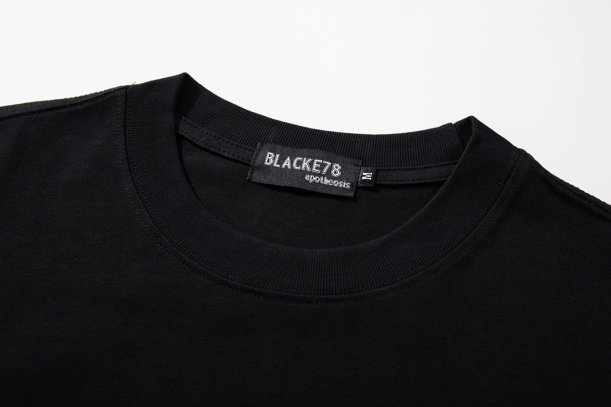 BLACK E78 THAT'S YOUR LOSS SLOGAN T-SHIRT; Black; garment construction detail