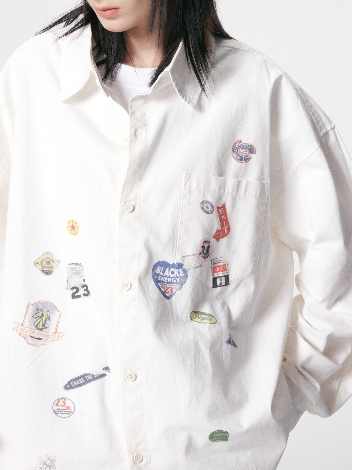 BLACK ENERGY | Badge Collage Raw Hem Shirt in White - model view