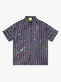 SAVAGE BASE | Paint Splatter Script Plaid Shirt in Black - front view