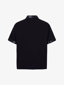 MCCNN | Ornamental Text Contrast-Trim Polo Shirt in Black - back view